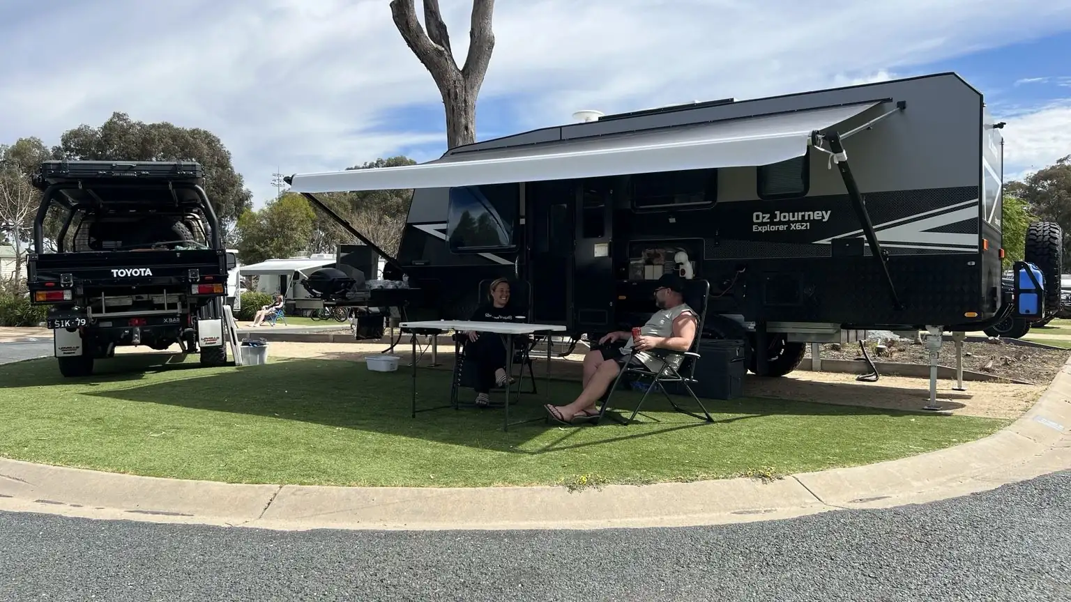 Oz Journey Explorer X621 off-road caravan set up at a caravan park with the awning out