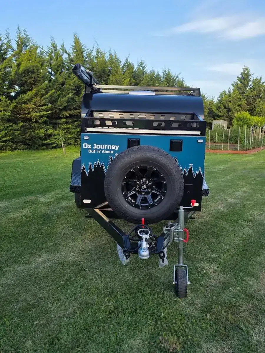 Front of the camper with spare wheel and coupling