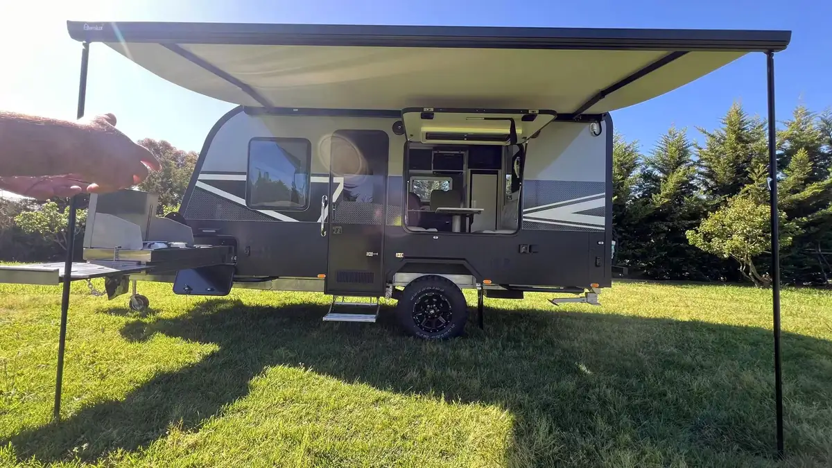 Explorer X216 with awning out and slide-out outdoor kitchen