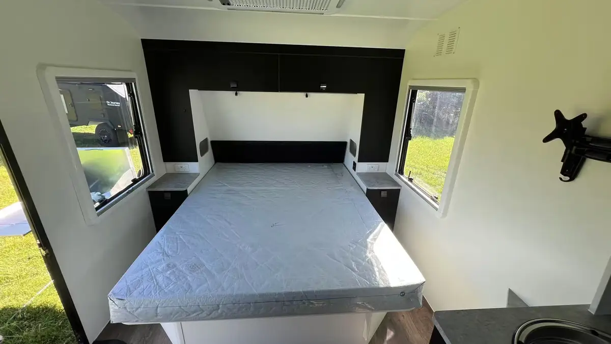 Explorer X216 queen bed with overhead cupboards